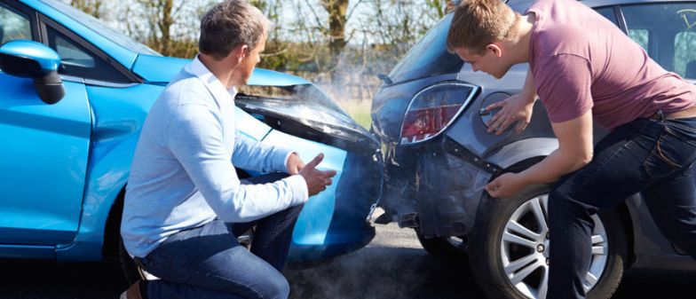 Drivers Inspecting Damage